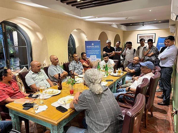 Members of the Adventure Travel Trade Association gathered for a dinner meeting at Chiya Pasal restaurant, Nepali Ghar Hotel, seated around one long table.