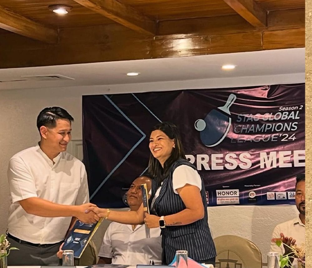A handshake and MOU signing held during a press meet for a sporting partnership, hosted in the Baithak meeting room at Nepali Ghar Hotel, Kathmandu, in 2024.