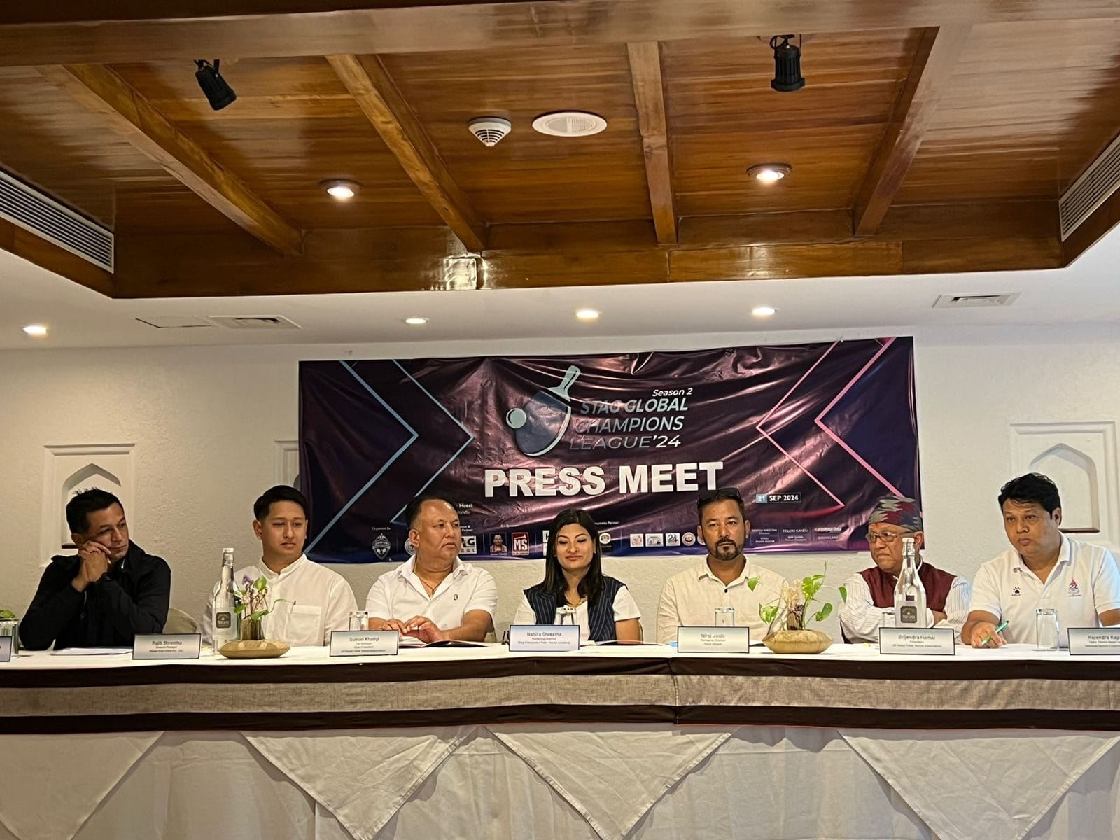 The STAG Global Champions League '24 press meet panel seated on stage, an event hosted with Nepali Ghar Hotel as the hospitality partner in Kathmandu, Nepal.