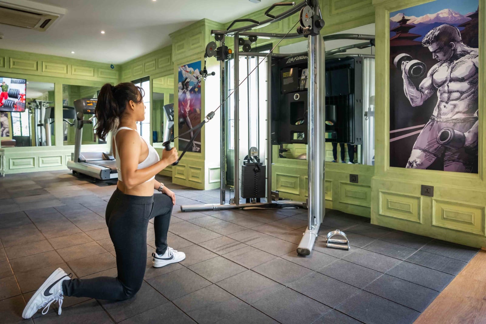 A guest training on the cable machine at the Vyayam Fitness Centre, the gym at Nepali Ghar Hotel in Thamel, Kathmandu, open daily for guest strength workouts.