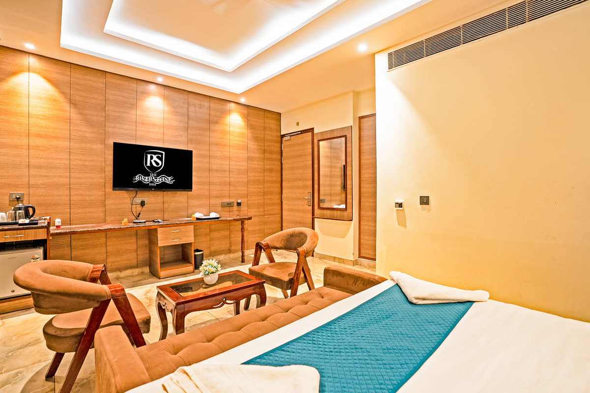 Lounge seating and the television in an Executive Room