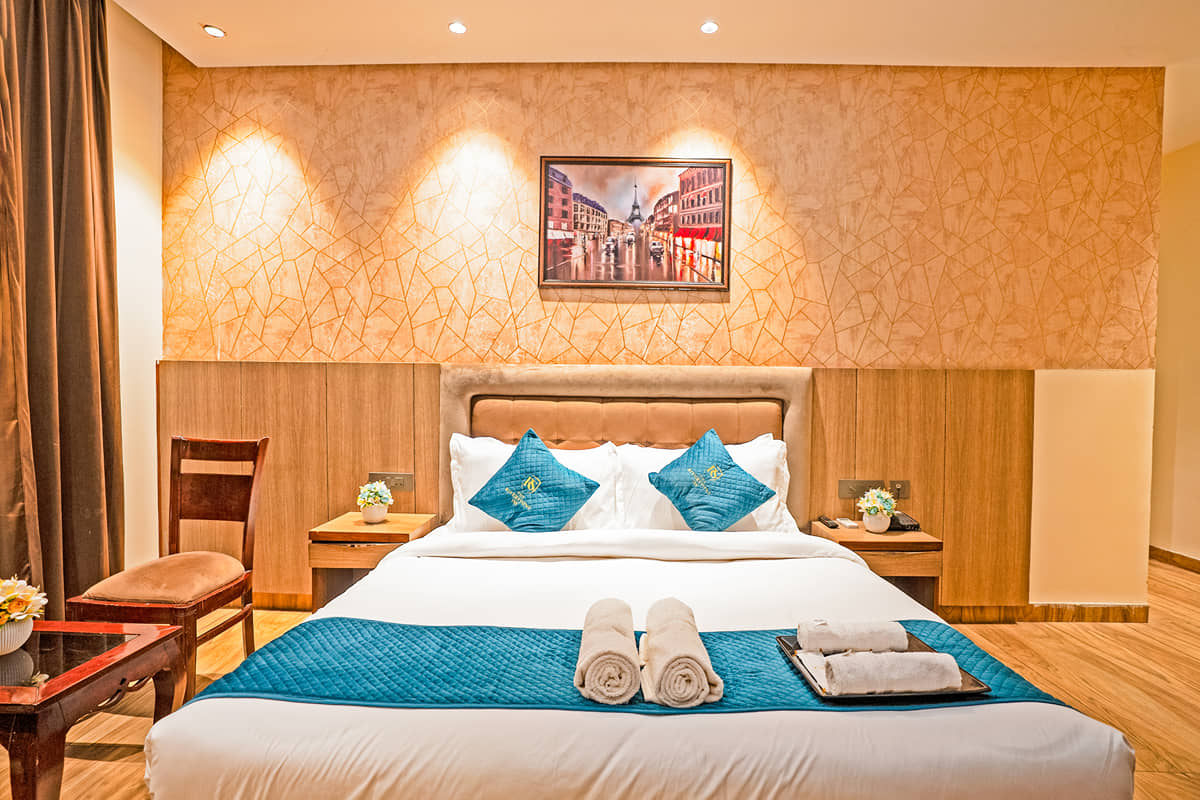 The king-size bed in a Superior King room at The Riverstone Inn