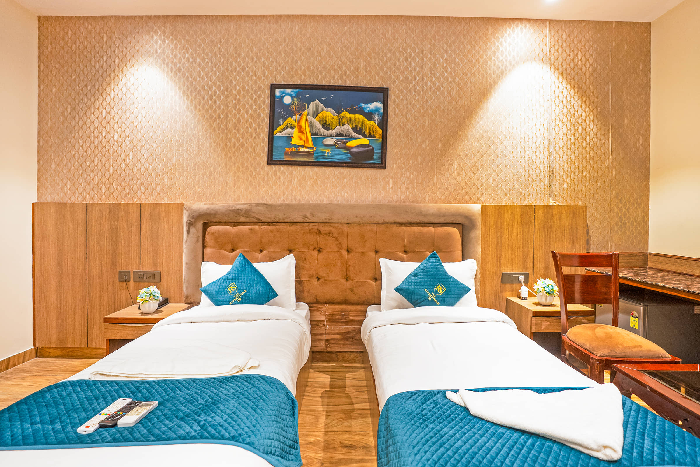 Twin beds against a padded headboard in a Superior Twin room