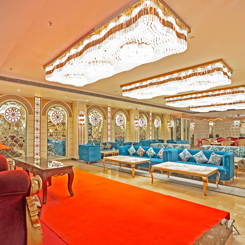 The banquet hall set with a red carpet aisle