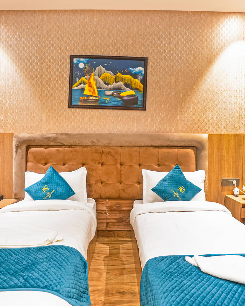 Twin beds against a padded headboard in a Superior Twin room