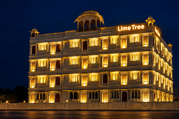 Heritage-style facade of Lime Tree Hotel & Banquet, Jaipur, lit up at night