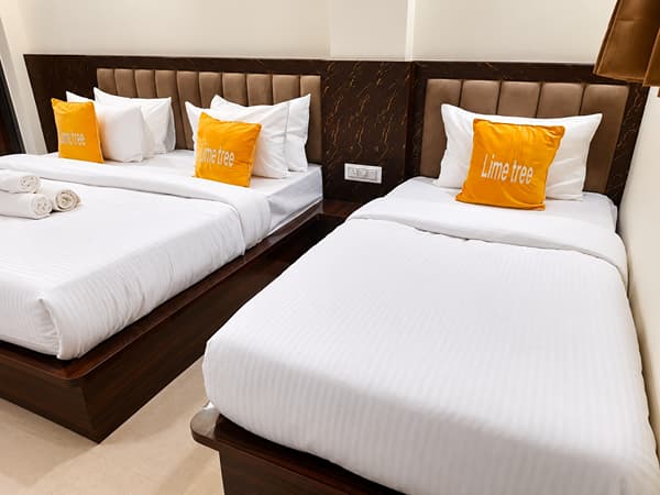 Family Room king bed and single bed with Lime Tree cushions at Lime Tree Hotel, Vrindavan