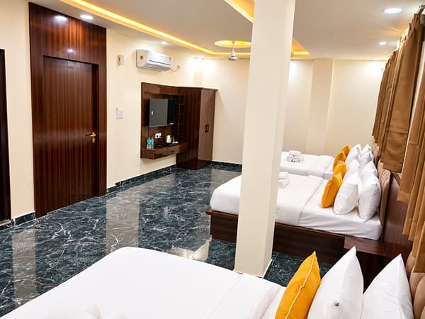 Family Suite beds and dressing unit near the door at Lime Tree Hotel, Vrindavan