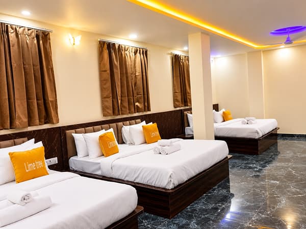 Family Suite king beds with Lime Tree cushions by the windows at Lime Tree Hotel, Vrindavan