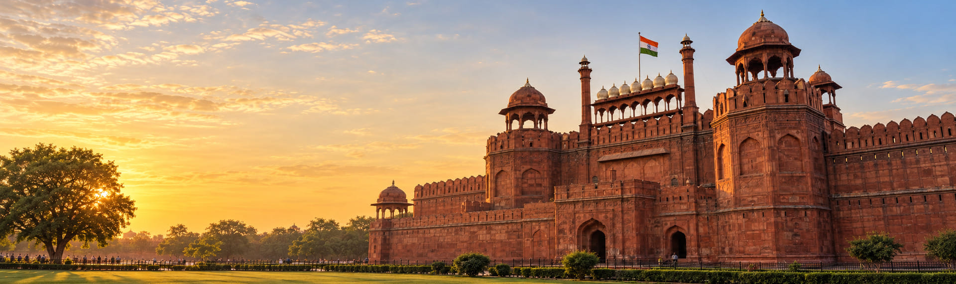 The Red Fort at sunset, its ramparts running the length of the frame