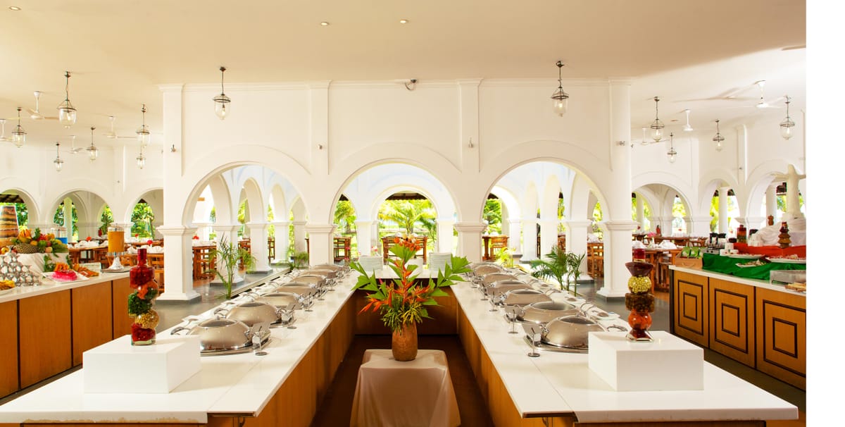 Fine dining by the pool at Le Pondy Beach Resort