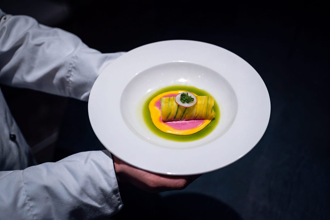 A plated dish being served at Azul, RG Grand