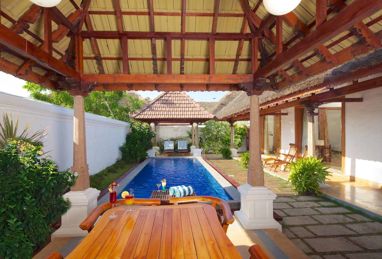 Private swimming pool under gazebo