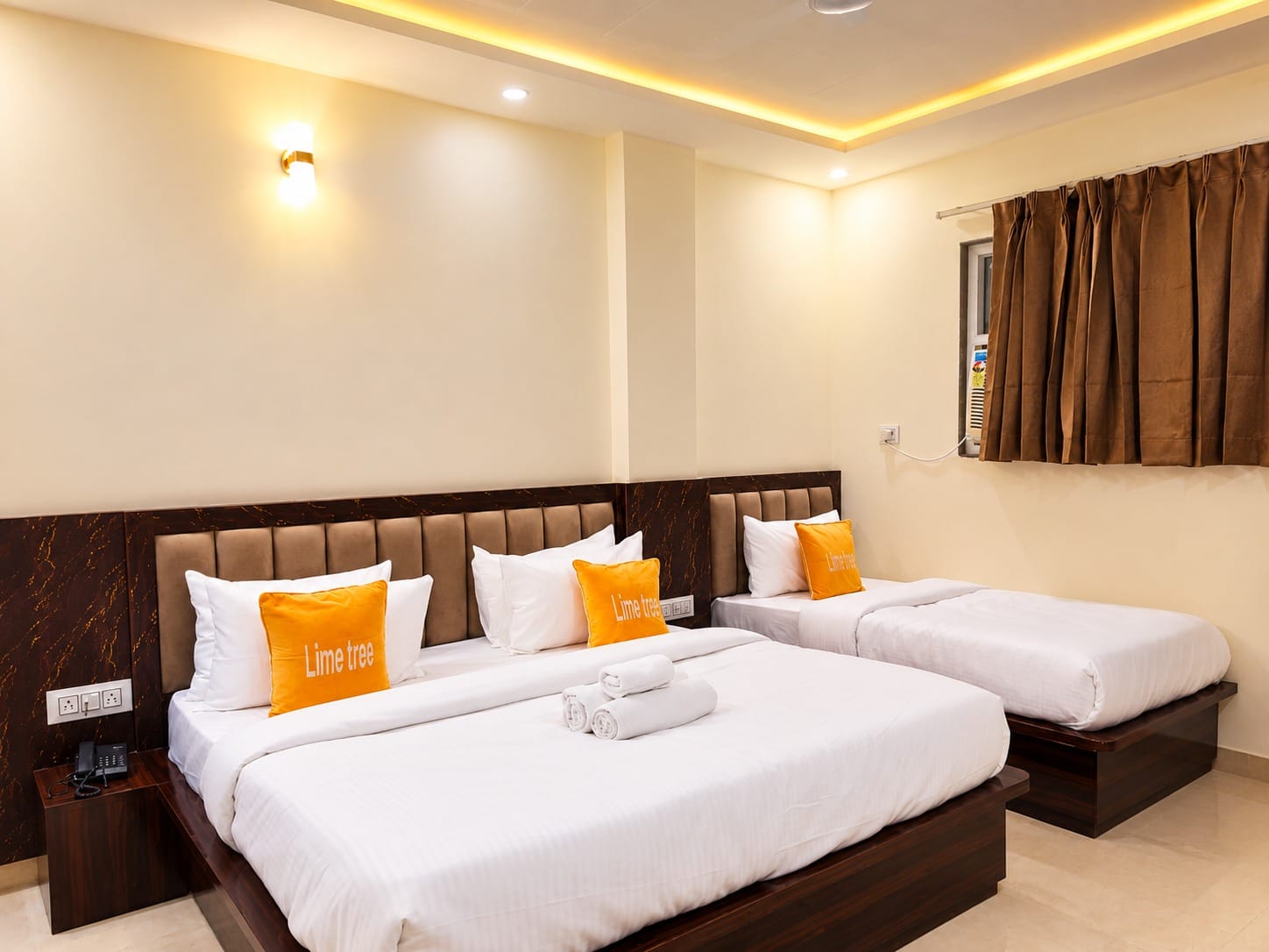 Family Room with a king size bed and a single bed at Lime Tree Hotel, Vrindavan