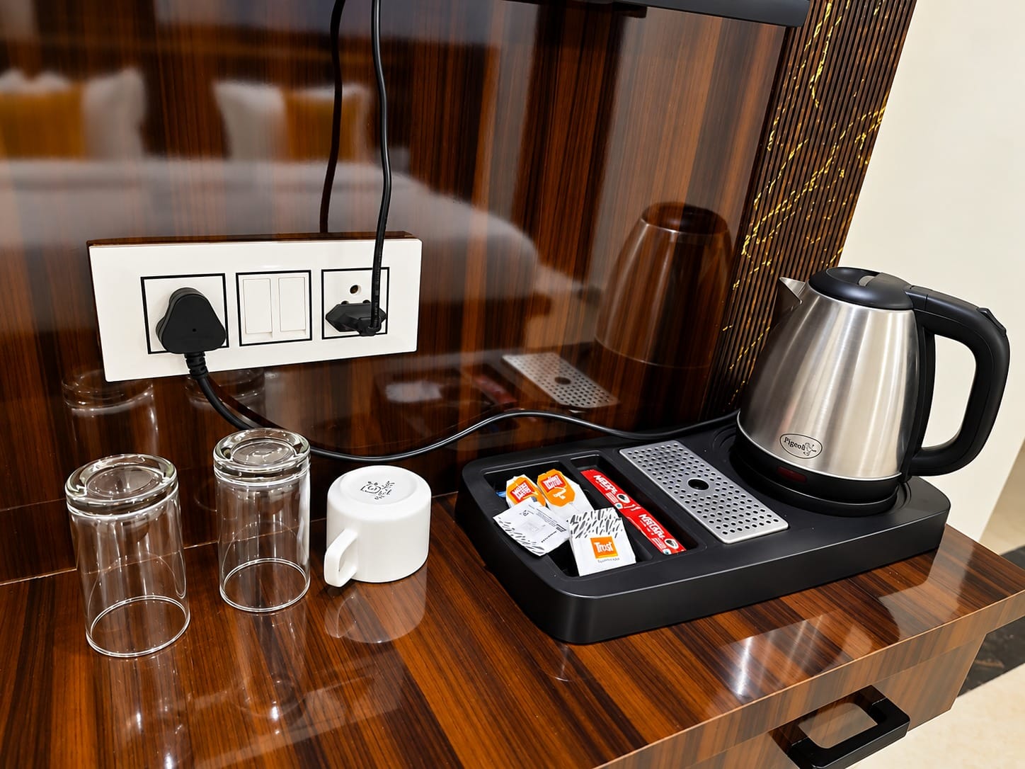 Tea and coffee tray with an electric kettle and glasses at Lime Tree Hotel, Vrindavan