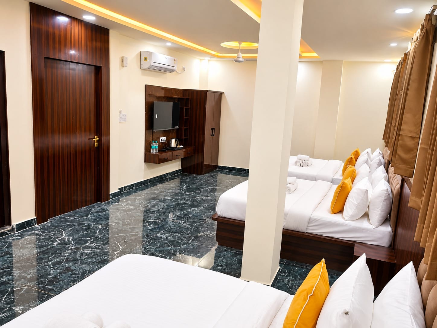 Family Suite beds and dressing unit near the door at Lime Tree Hotel, Vrindavan
