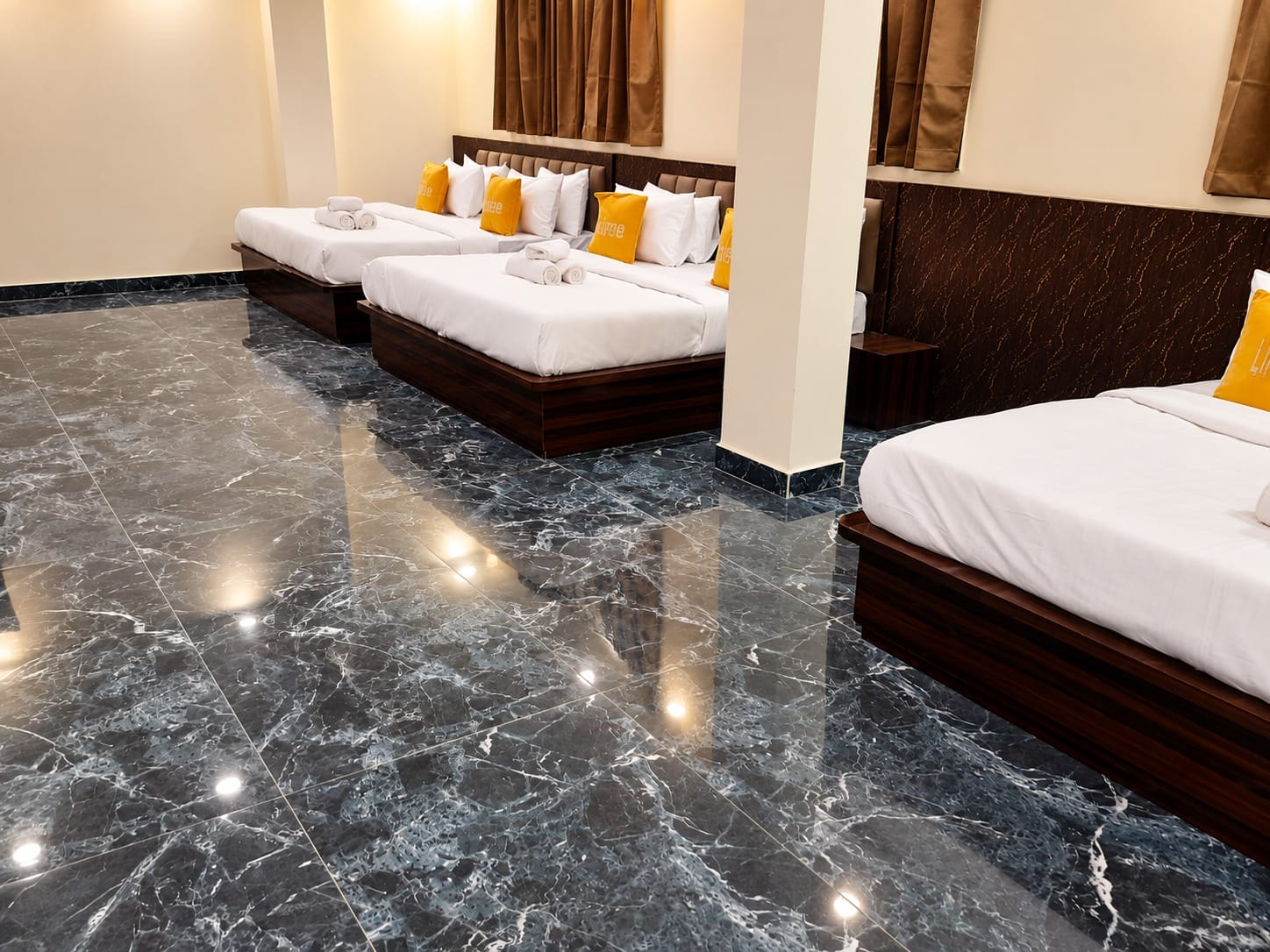 Family Suite with king size beds and a marble floor at Lime Tree Hotel, Vrindavan