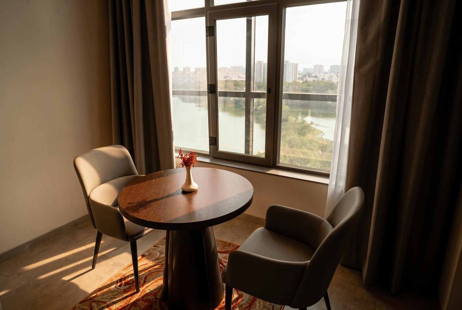 Deluxe Suite &mdash; The dining table, at the window