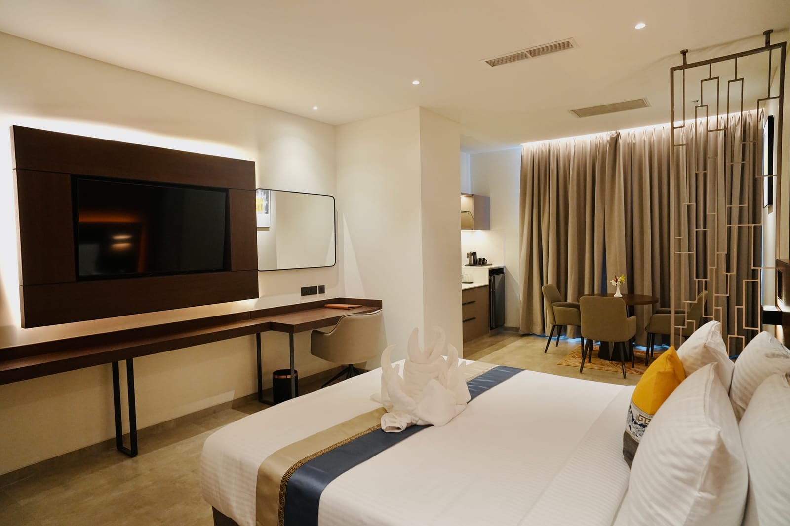 Deluxe Suite &mdash; The living area and kitchenette