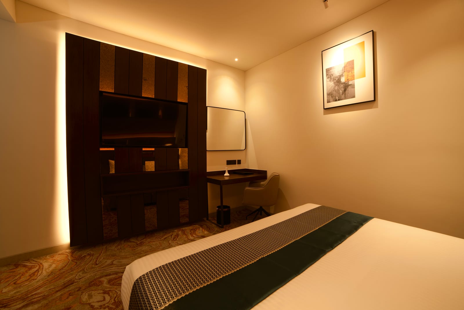 Executive Suite &mdash; The bedroom, with its panelled wall