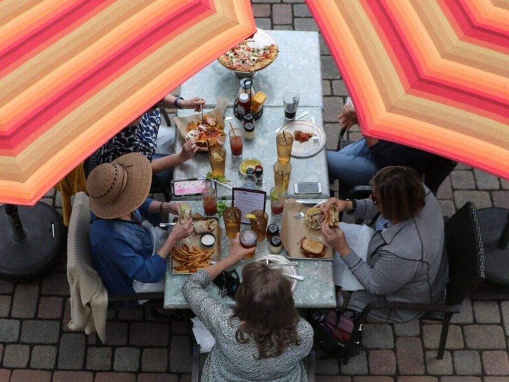 Guests gathered around a table at the riverside Tapoco Tavern.