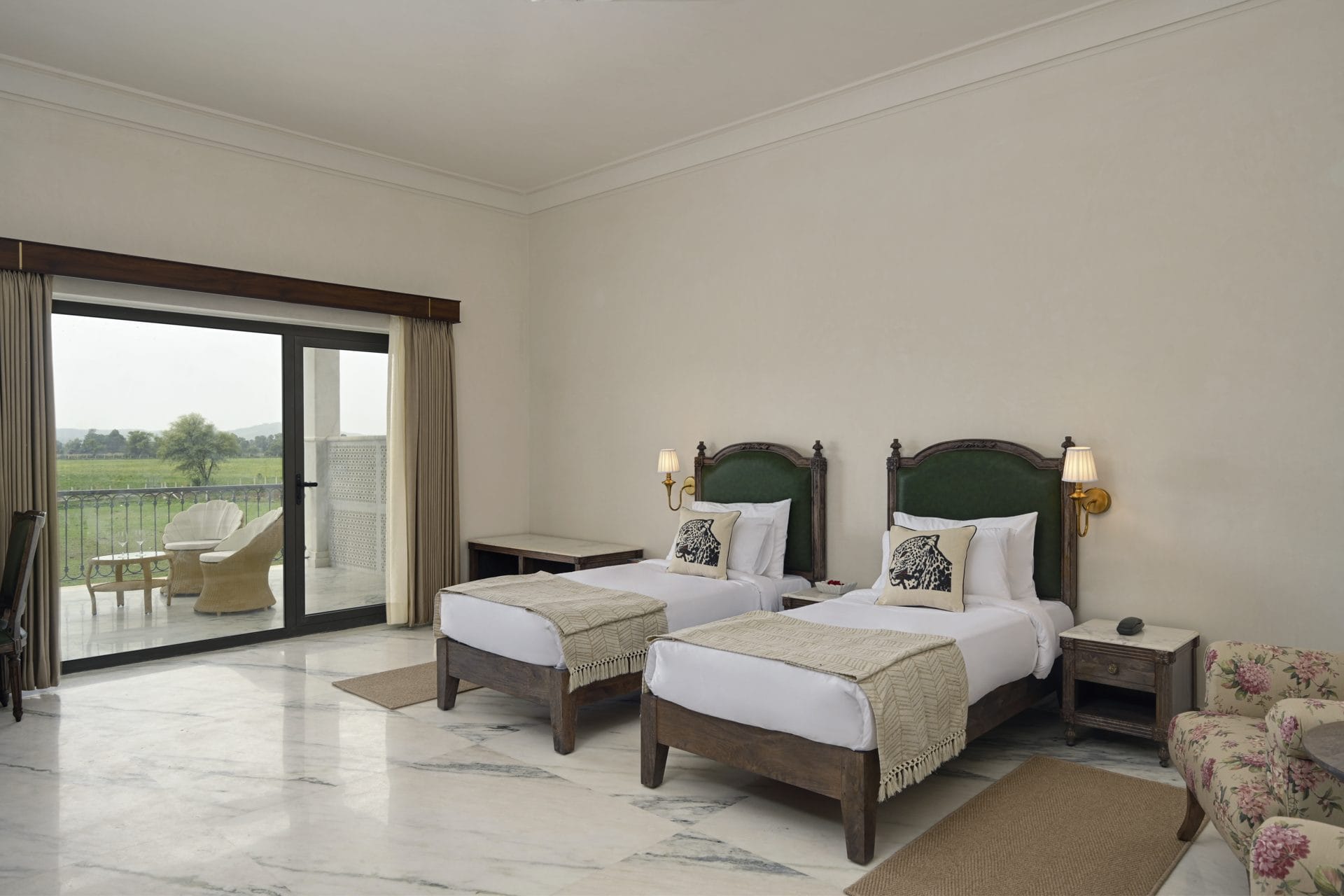 Twin Bed Room with 2 single beds and the balcony door open to farmland