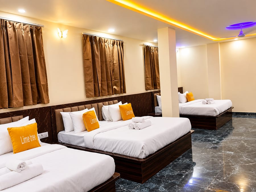 Family Suite king beds with Lime Tree cushions by the windows at Lime Tree Hotel, Vrindavan