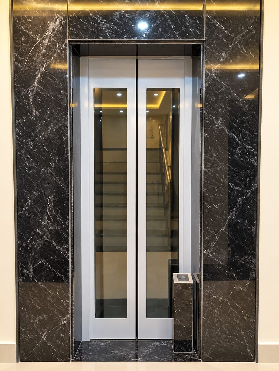 Lift lobby with black marble walls at Lime Tree Hotel, Vrindavan