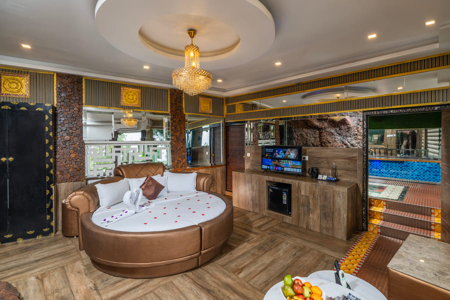 Double Bedroom Pool Villa at Parakkat Nature Resort Munnar with sparkling private swimming pool on an expansive wooden terrace cantilevered over emerald tea estates