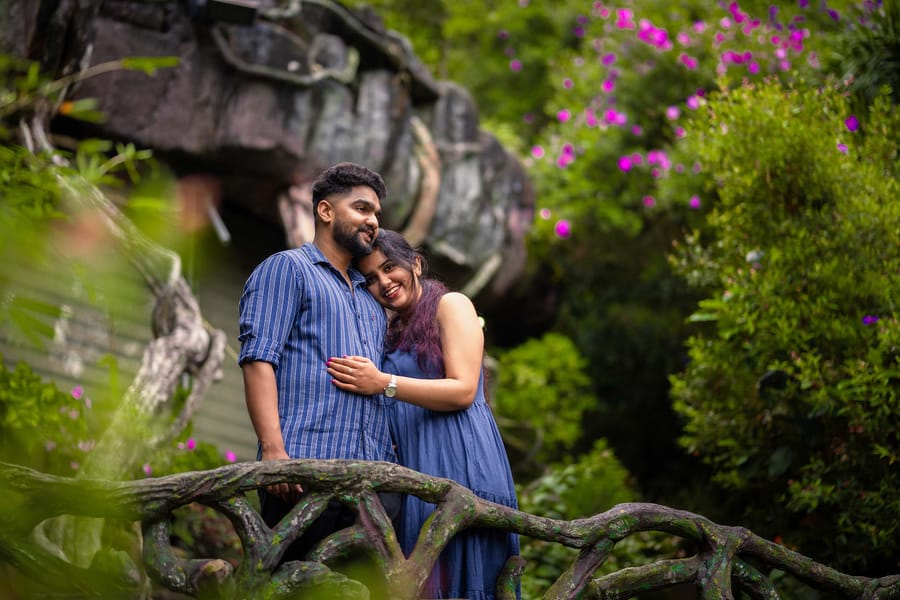 Kerala first ever Cave Room at Parakkat Nature Resort with subterranean natural sculpted rock walls, warm recessed gold lighting, opulent luxury bed and tranquil earthy ambiance
