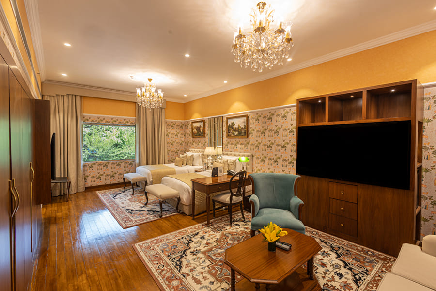 Luxury King Bed Room Living Area at The Claridges, New Delhi