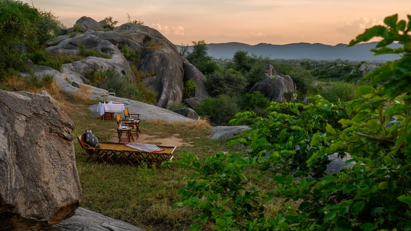 Sundowner seating tucked among the boulders and scrub