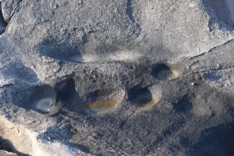 Cupules, cup-shaped marks pounded into the rock by hand, on a Tehla boulder