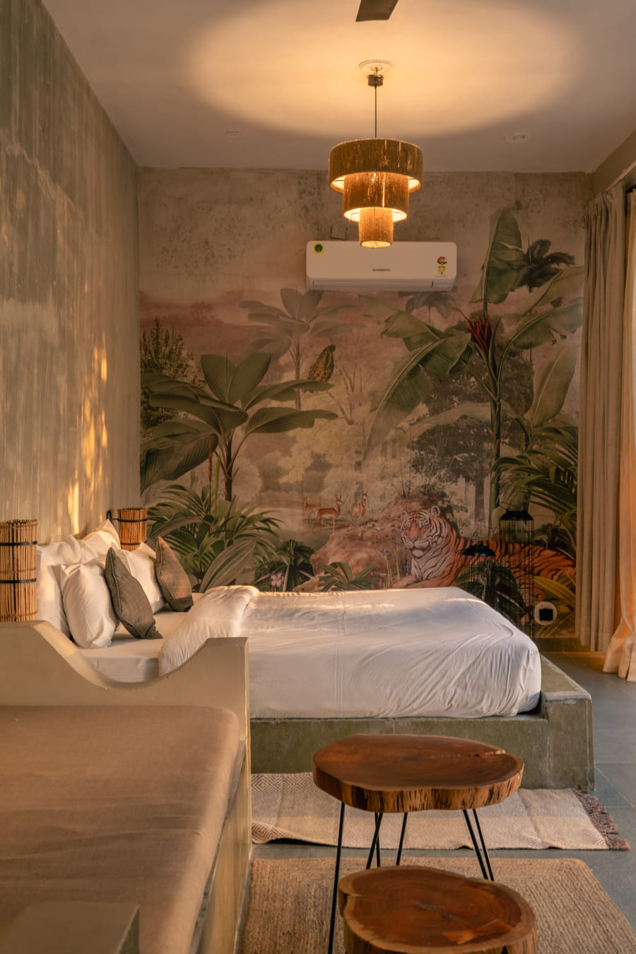 A Stone Cabin bed set against its hand-painted mural wall