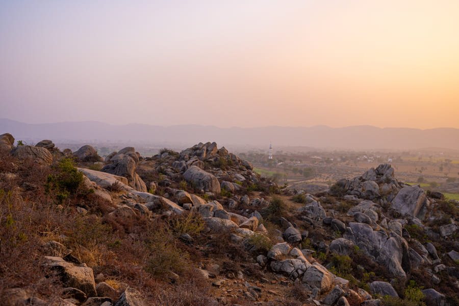 Boulders scattered along a ridge at dusk