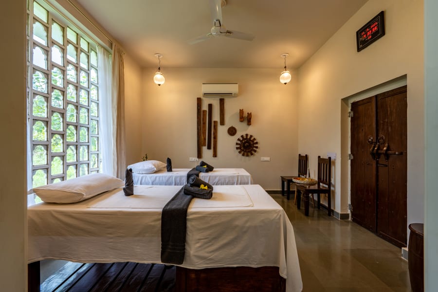 A spa treatment room with twin therapy tables