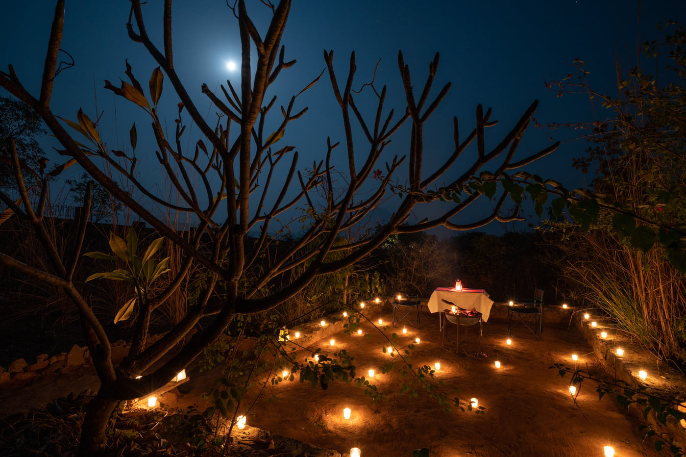 A private dinner setting among the boulders