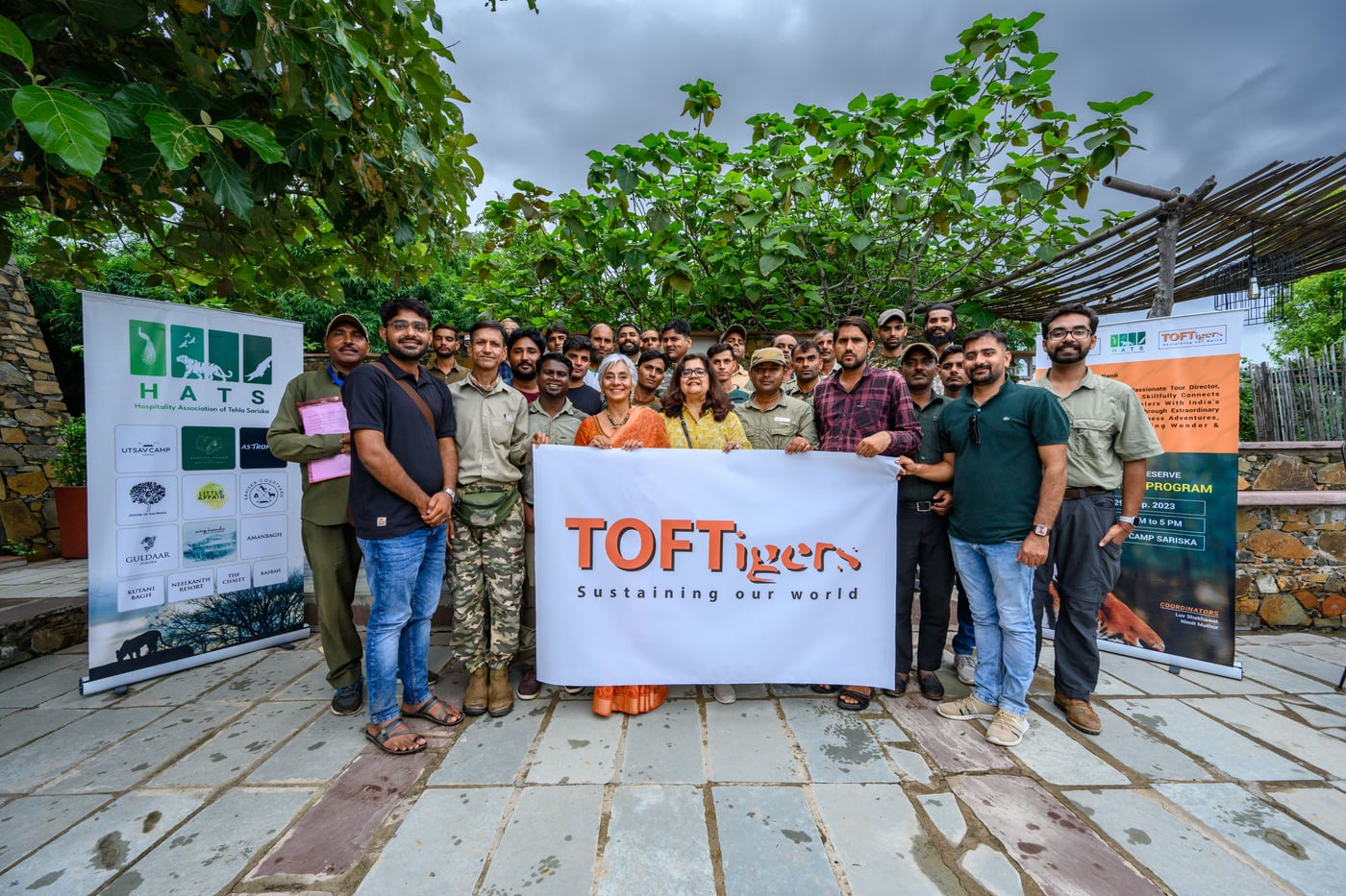 An image of a group of people with the TOFT award banner - Utsav Camp Sariska