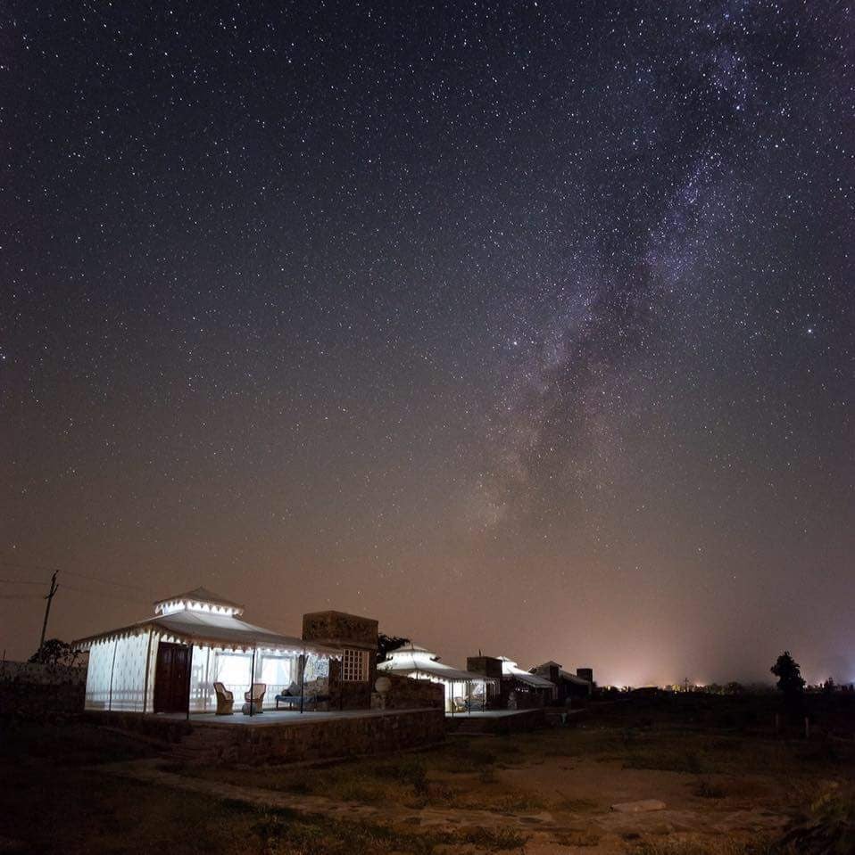 A facade image of the Utsav Camp Sariska which is brightly lit