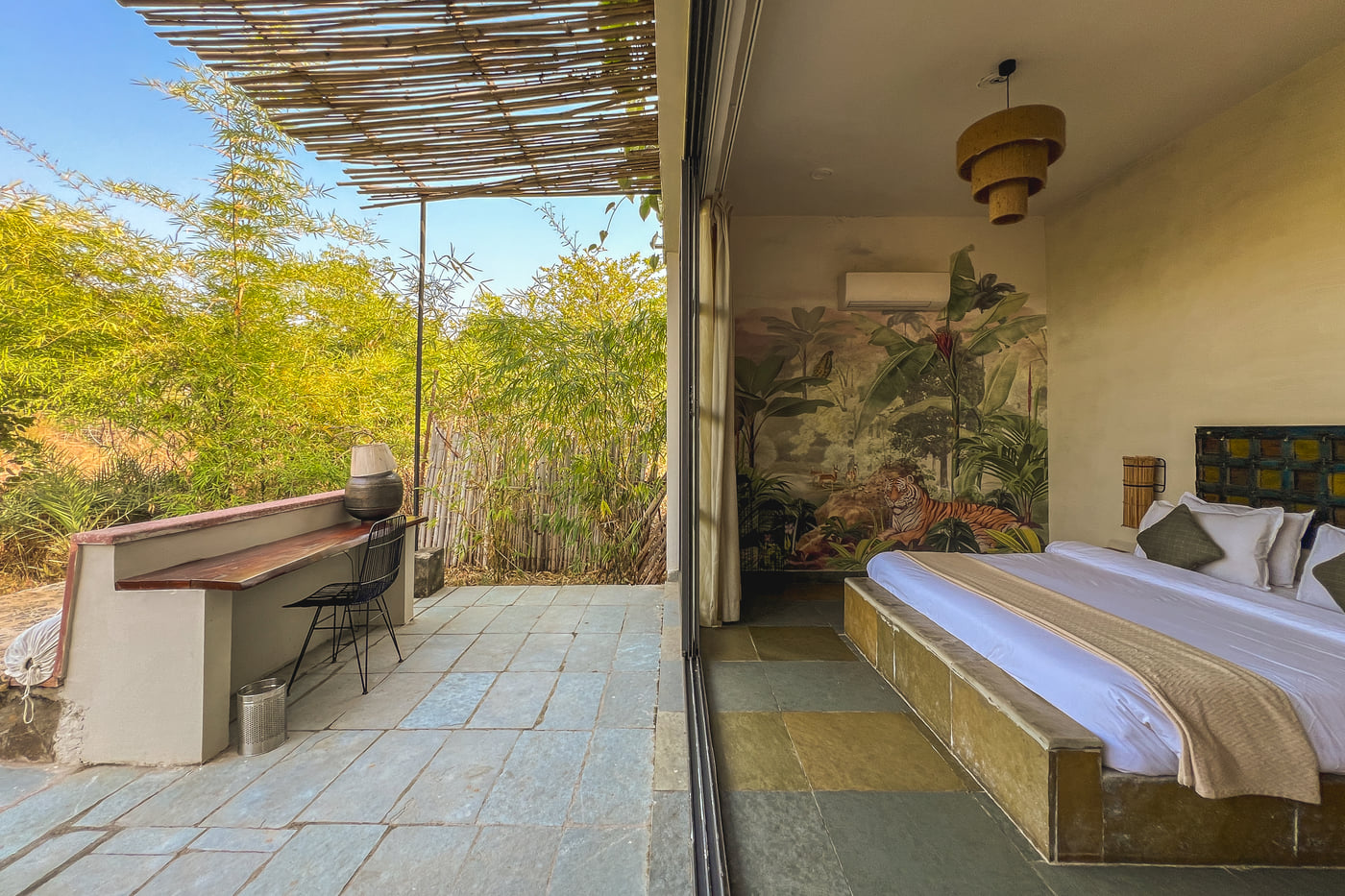 An image of the Stone Cabin with a balcony open to the lush greenery - Utsav Camp Sariska