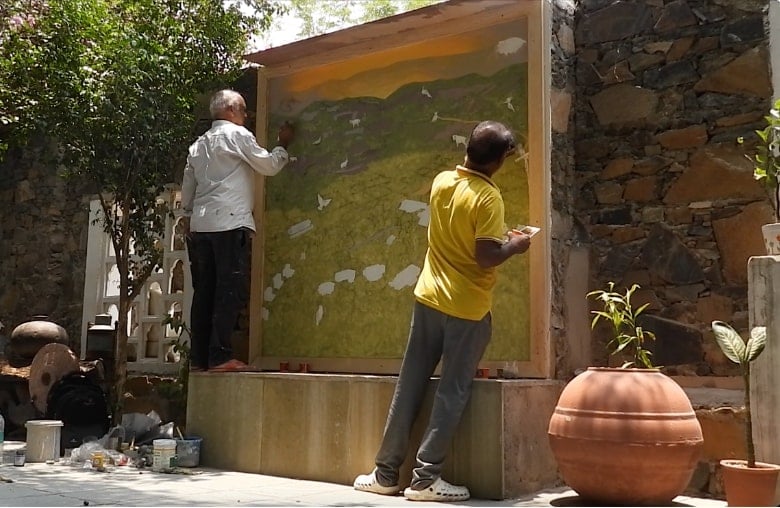 Artists filling colours on the naturalist map in progress at Utsav Camp Sariska.