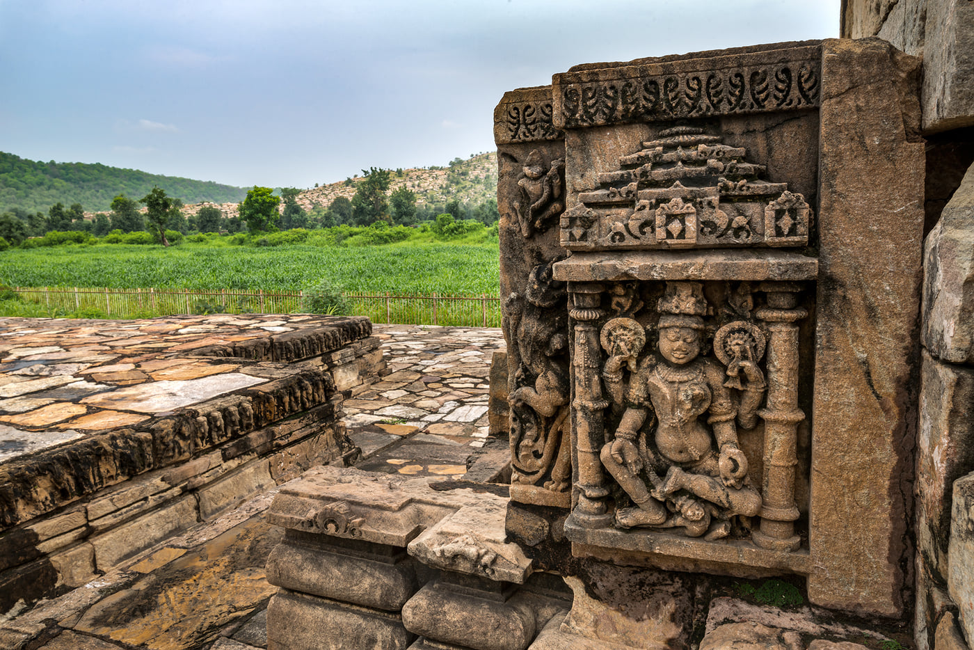An image of beautiful carvings of gods on the walls of Neelkanth Temple