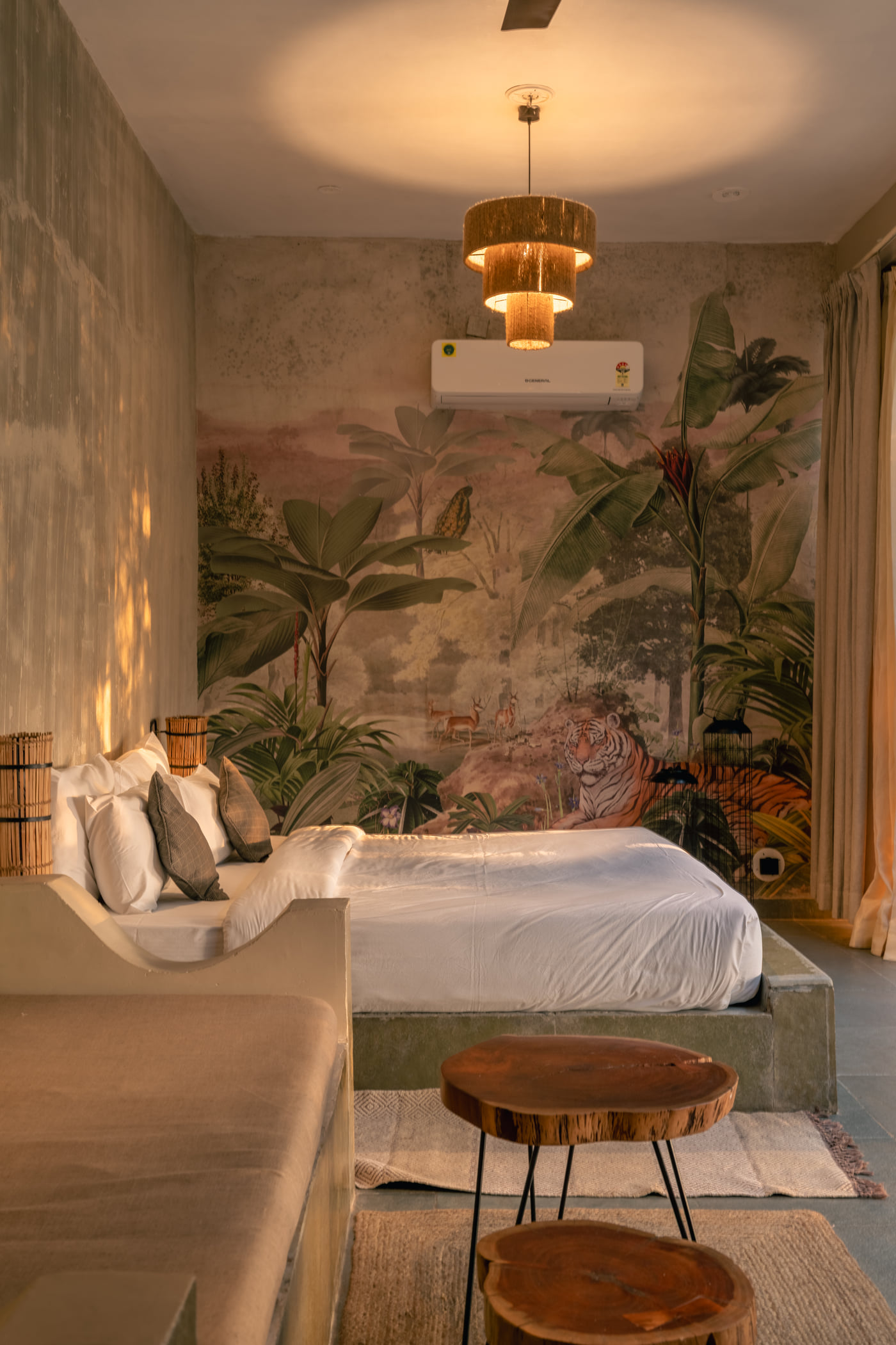 A Stone Cabin bed set against its hand-painted mural wall