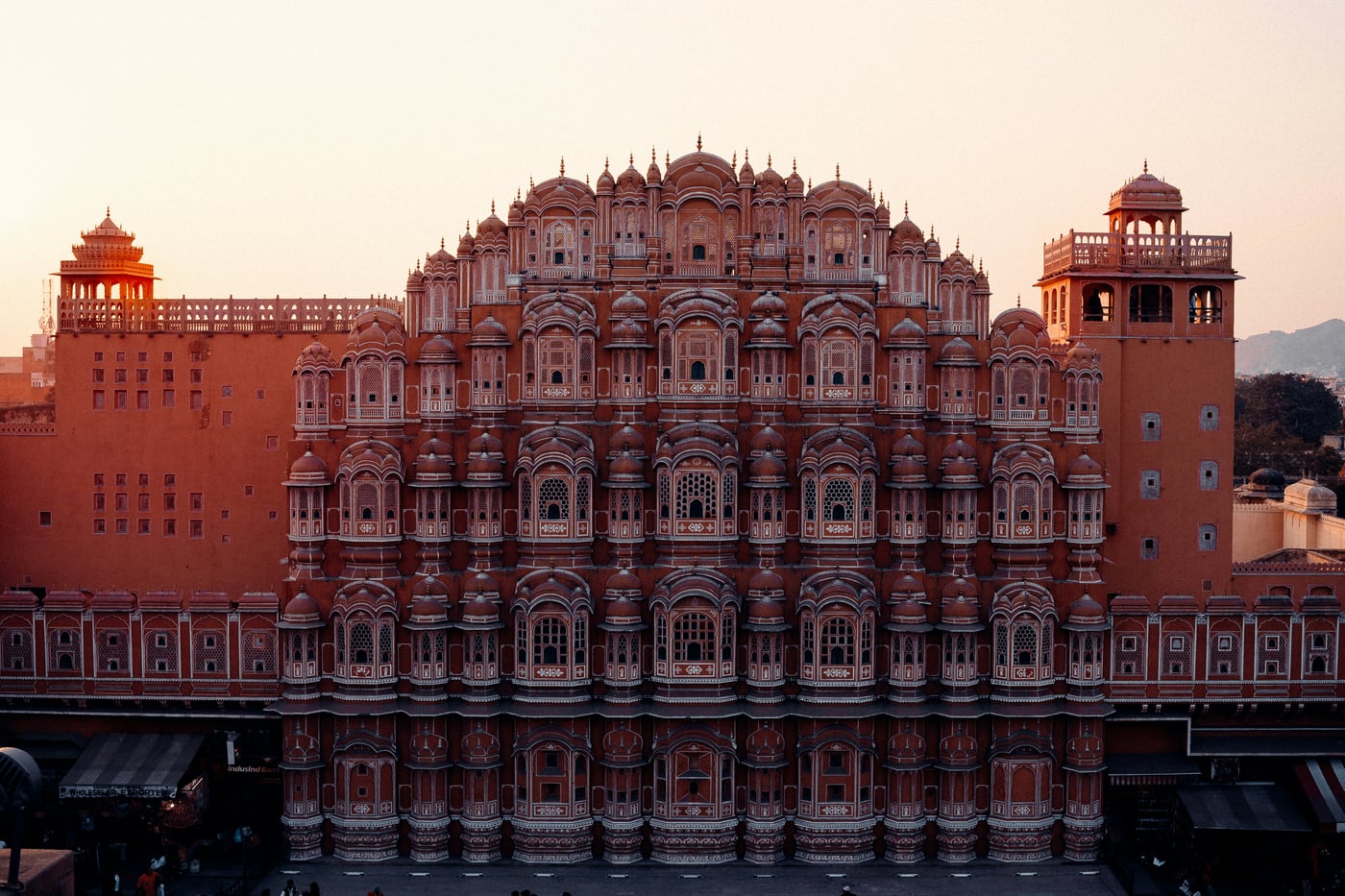 Facade view of Hawa Mahal in Jaipur with the twilight sun's ray's hitting the building.