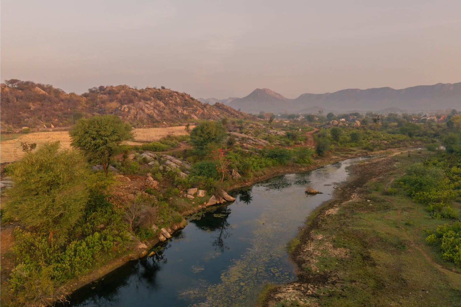 The boulders of Tehla scattered along a winding waterway, seen from the air