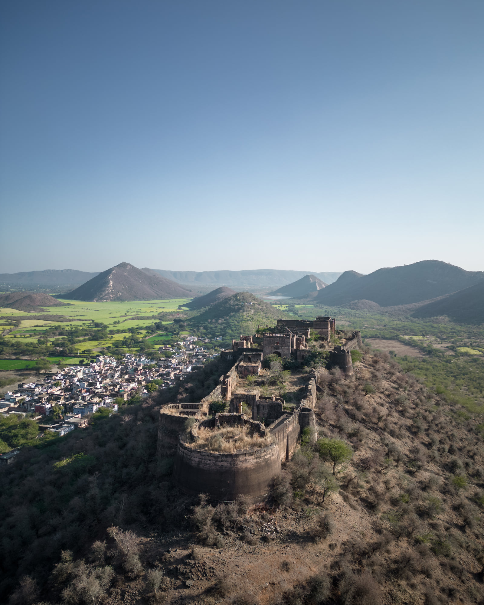 A hilltop fort above the village and open plains of Tehla, seen from the air