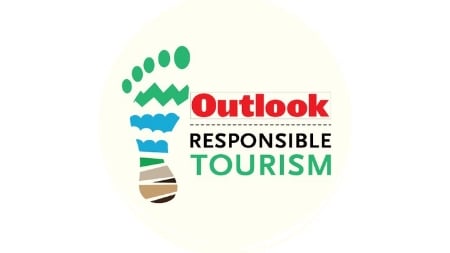 A logo of Outlook Responsible Tourism. It also features a footprint of a human.