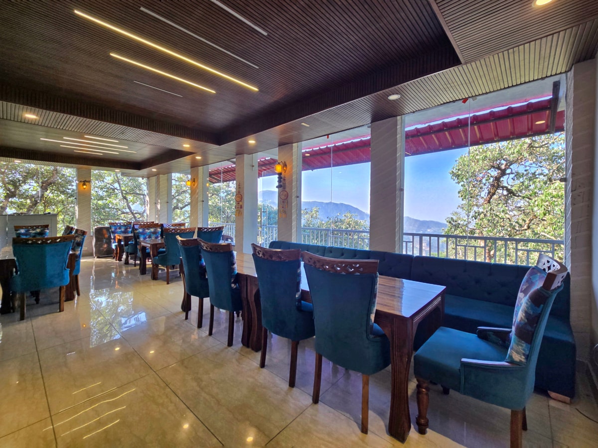 In-house multi-cuisine restaurant terrace at Kavin Highland, Dalhousie