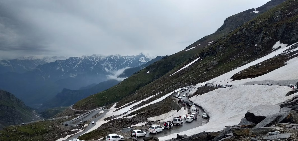 Motorcycle rider on a Himachal mountain road