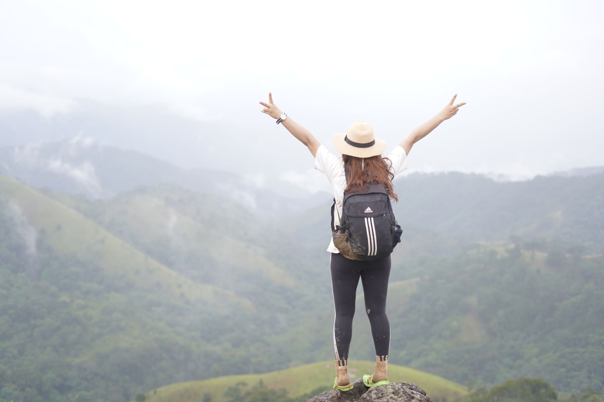 Solo woman traveller enjoying a Himachal mountain view